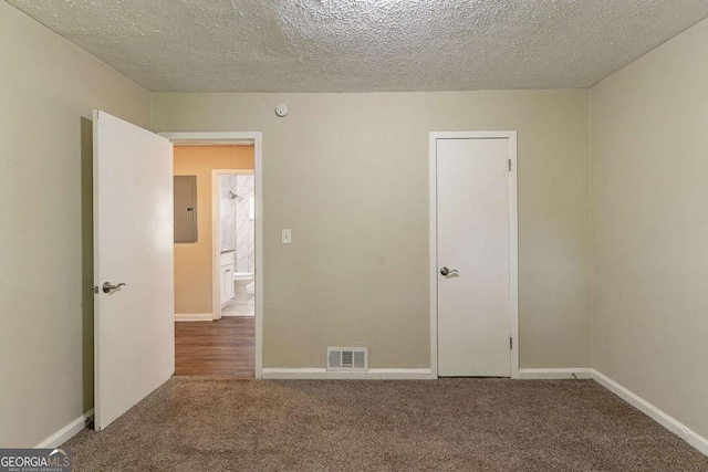 2304 Ousley Ct, Decatur, GA 30032 - carpeted empty room with a textured ceiling, baseboards, and visible vents