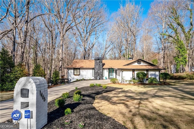 1466 W Lake Dr, Gainesville, GA 30501 - view of front of property featuring concrete driveway and a chimney