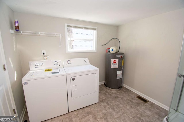 226 Vine St, Athens, GA 30601 - laundry area featuring electric water heater and independent washer and dryer