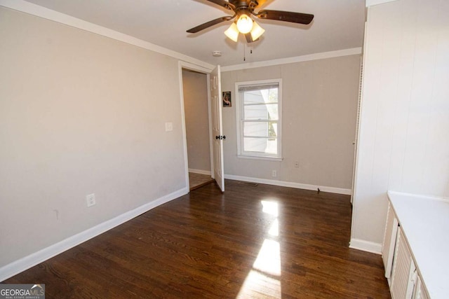 226 Vine St, Athens, GA 30601 - spare room with dark wood-style flooring, a ceiling fan, and crown molding