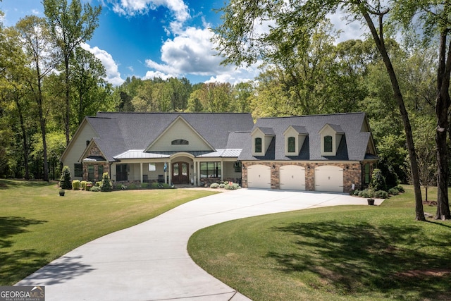 145 Carrington Ln, Brooks, GA 30205 - view of front of house featuring a front yard, an attached garage, curved driveway, and stone siding