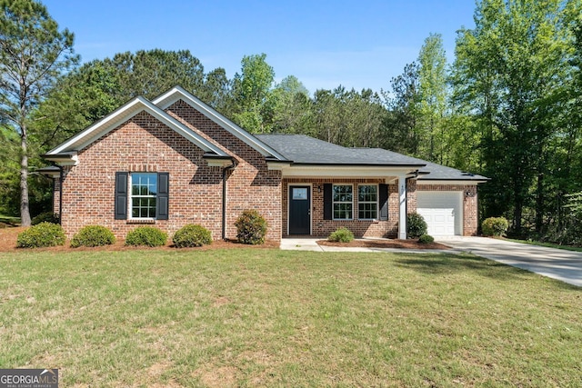 485 Swint Rd, Griffin, GA 30224 - single story home featuring a garage, driveway, brick siding, and a front lawn