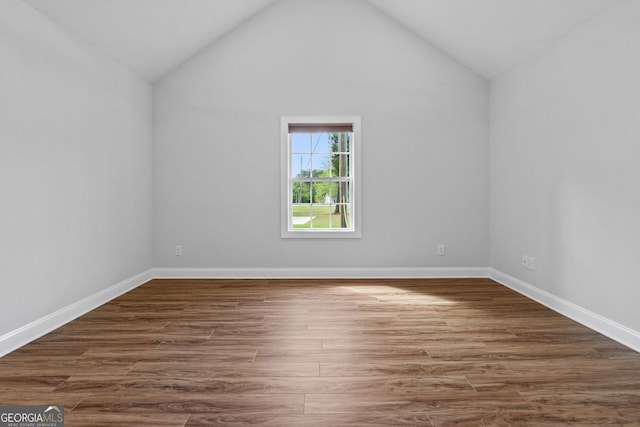 485 Swint Rd, Griffin, GA 30224 - additional living space with dark wood-style flooring, lofted ceiling, and baseboards