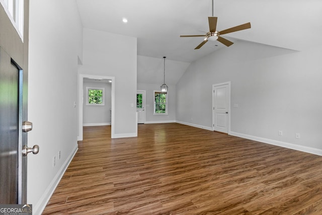 485 Swint Rd, Griffin, GA 30224 - unfurnished living room with high vaulted ceiling, wood finished floors, ceiling fan, baseboards, and recessed lighting