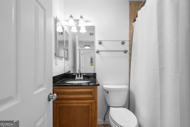 1468 Briarwood Rd NE Unit 602, Atlanta, GA 30319 - full bathroom featuring visible vents, toilet, a shower with shower curtain, and vanity