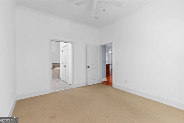 11 Perimeter Ctr E Unit 1404, Atlanta, GA 30346 - unfurnished bedroom featuring carpet floors, crown molding, ensuite bathroom, and ceiling fan