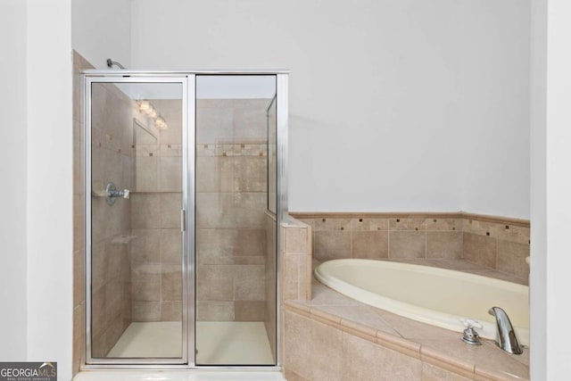 11 Perimeter Ctr E Unit 1404, Atlanta, GA 30346 - full bathroom featuring a bath and a shower stall