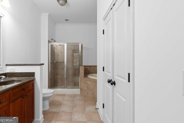 11 Perimeter Ctr E Unit 1404, Atlanta, GA 30346 - bathroom featuring a garden tub, a shower stall, vanity, and tile patterned flooring