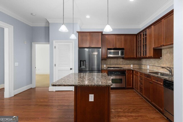 11 Perimeter Ctr E Unit 1404, Atlanta, GA 30346 - kitchen featuring stainless steel appliances, glass insert cabinets, backsplash, a kitchen island, and dark stone counters