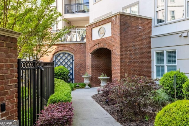 11 Perimeter Ctr E Unit 1404, Atlanta, GA 30346 - entrance to property featuring stucco siding, a gate, and brick siding