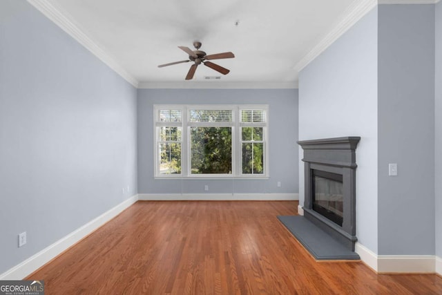 11 Perimeter Ctr E Unit 1404, Atlanta, GA 30346 - unfurnished living room featuring wood finished floors, a ceiling fan, a glass covered fireplace, and ornamental molding