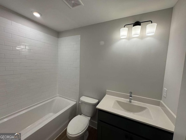 bathroom featuring  shower combination, vanity, visible vents, and toilet
