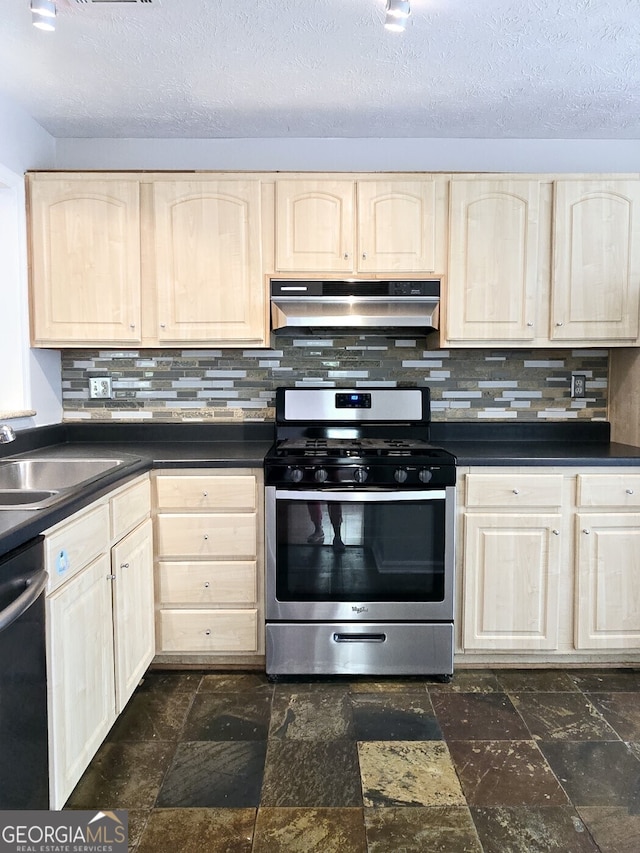 kitchen with under cabinet range hood, dishwasher, stainless steel range with gas stovetop, and light brown cabinetry