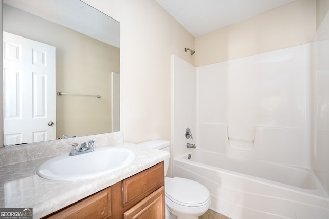 bathroom featuring toilet, bathing tub / shower combination, and vanity