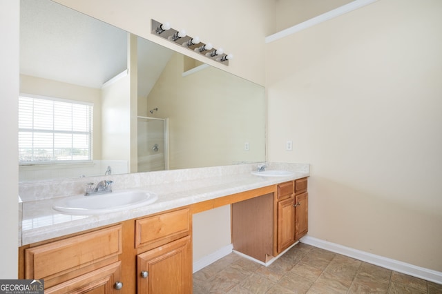 full bath featuring a sink, double vanity, baseboards, and a shower stall