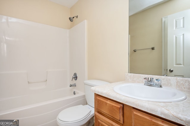 full bathroom featuring toilet, vanity, and tub / shower combination