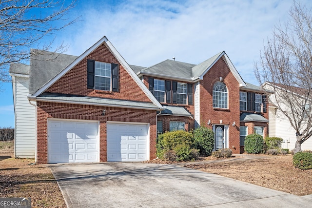 view of front of home featuring concrete driveway, a shingled roof, brick siding, and an attached garage