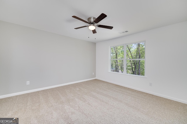 100 N Stewart Ln, Griffin, GA 30224 - unfurnished room featuring baseboards, a ceiling fan, visible vents, and carpet floors