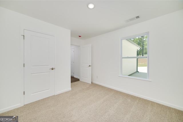100 N Stewart Ln, Griffin, GA 30224 - unfurnished bedroom with visible vents, baseboards, recessed lighting, and carpet floors