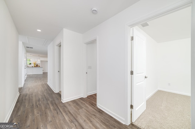 100 N Stewart Ln, Griffin, GA 30224 - hall with visible vents, baseboards, attic access, and wood finished floors