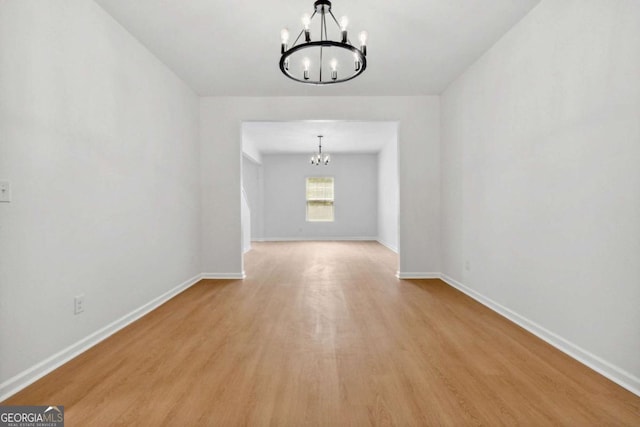 7431 Saint David St, Fairburn, GA 30213 - unfurnished room with a chandelier and wood finished floors