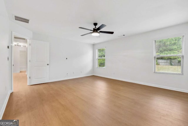 7431 Saint David St, Fairburn, GA 30213 - unfurnished room featuring light wood finished floors and ceiling fan