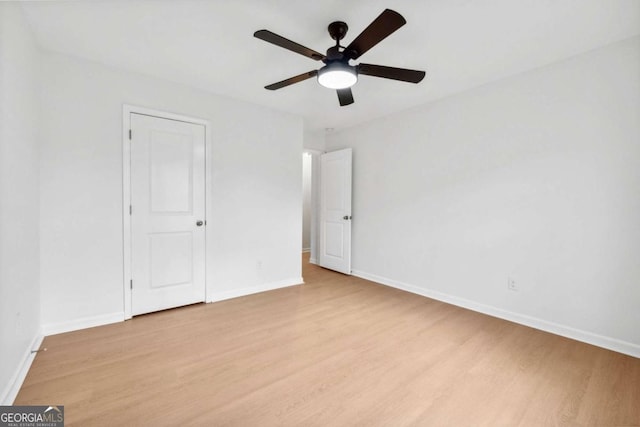 7431 Saint David St, Fairburn, GA 30213 - unfurnished bedroom with light wood-type flooring and ceiling fan