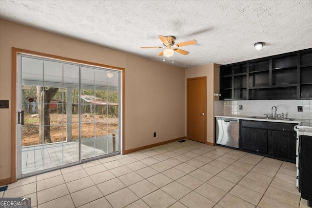 5026 Daniel Mill Rd, Winston, GA 30187 - kitchen with stainless steel dishwasher, dark cabinetry, ceiling fan, decorative backsplash, and open shelves