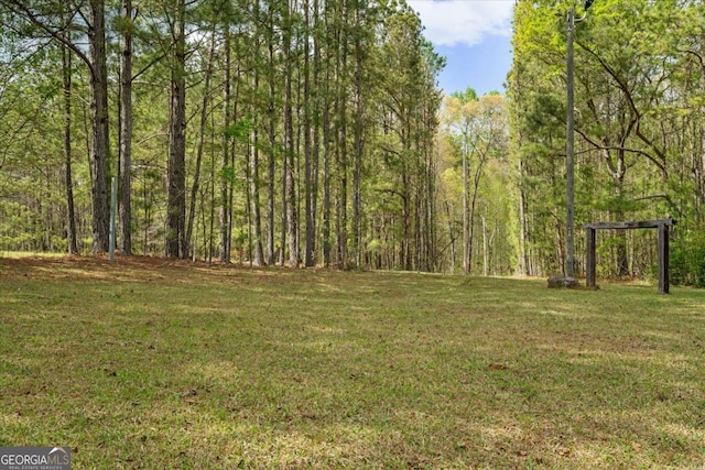 5026 Daniel Mill Rd, Winston, GA 30187 - view of grassy yard featuring a wooded view