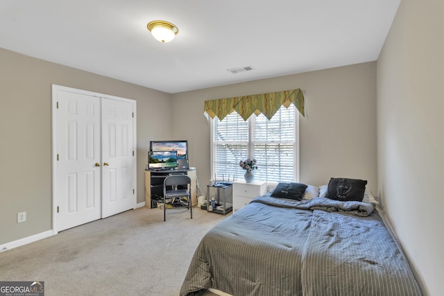 1812 Mountain Lake Dr NW, Kennesaw, GA 30152 - carpeted bedroom featuring a closet and baseboards