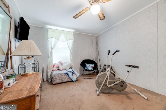 interior space with crown molding, ceiling fan, and carpet