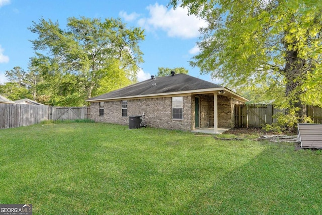 210 Preakness Dr, Hinesville, GA 31313 - rear view of house with a yard, a fenced backyard, brick siding, and a gate