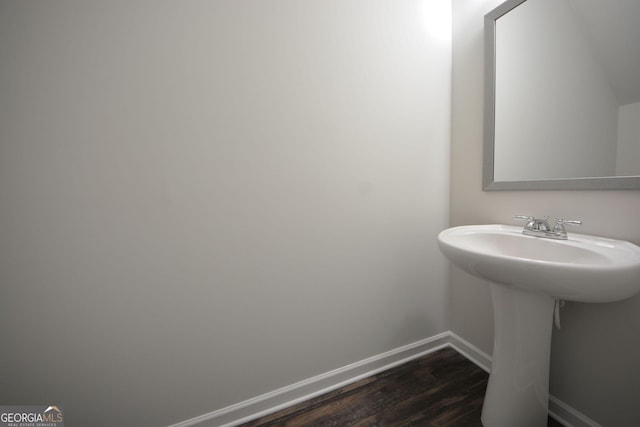 bathroom featuring baseboards and wood finished floors
