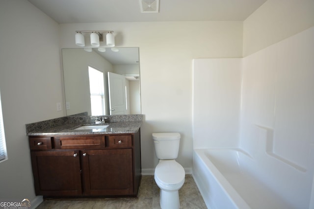 bathroom with visible vents, toilet, vanity, and baseboards