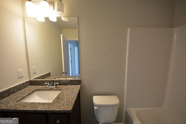 full bath with toilet and vanity