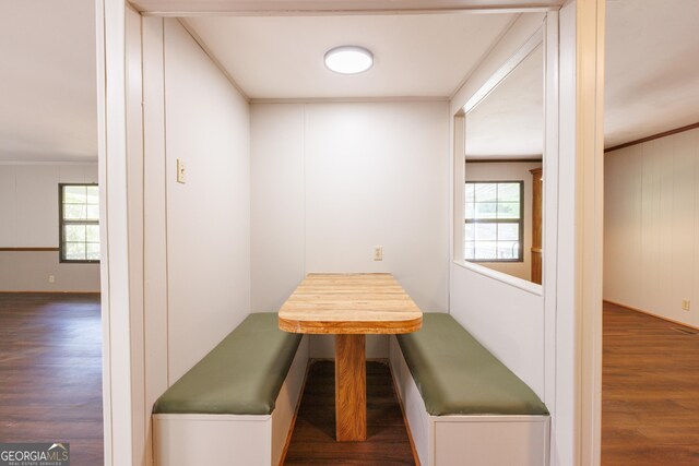 dining area with wood finished floors