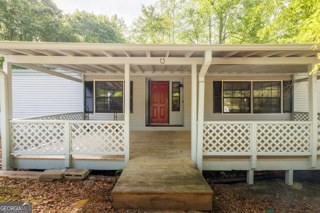 doorway to property with a porch