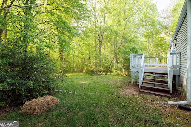view of yard featuring a deck