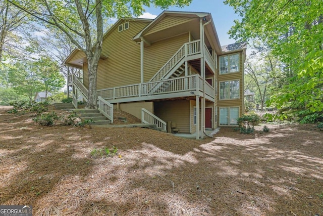 907 Country Park Dr SE, Smyrna, GA 30080 - rear view of property featuring stairway and a wooden deck