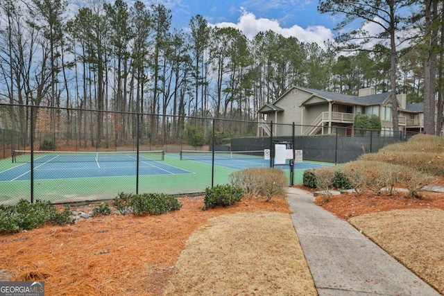 907 Country Park Dr SE, Smyrna, GA 30080 - view of tennis court with view of wooded area