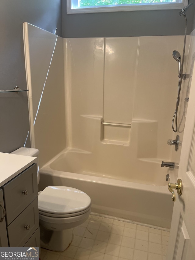 bathroom featuring toilet, shower / tub combination, and vanity