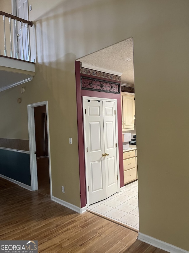 interior space featuring light wood-style flooring and baseboards
