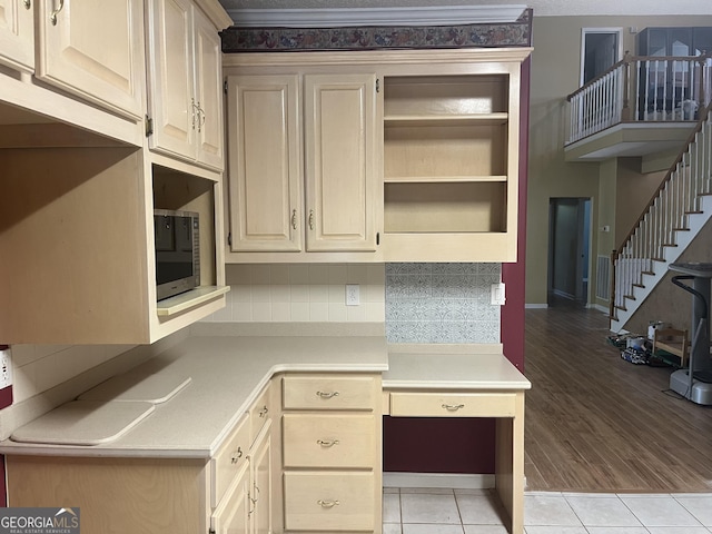 unfurnished office with baseboards and light tile patterned flooring