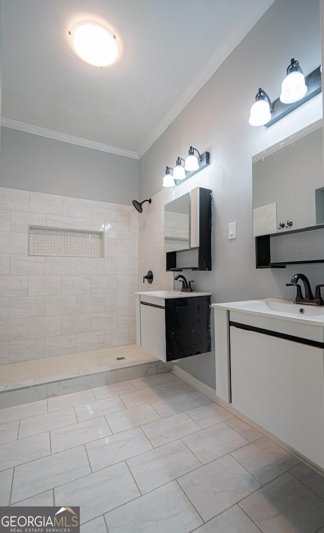 full bathroom with marble finish floor, a sink, crown molding, two vanities, and tiled shower