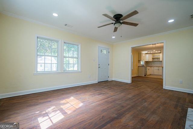 unfurnished living room featuring a ceiling fan, baseboards, ornamental molding, and visible vents