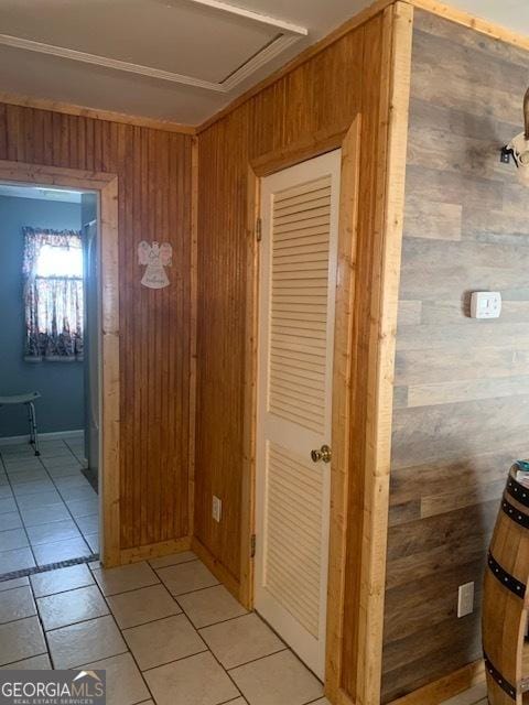 hallway with wood walls