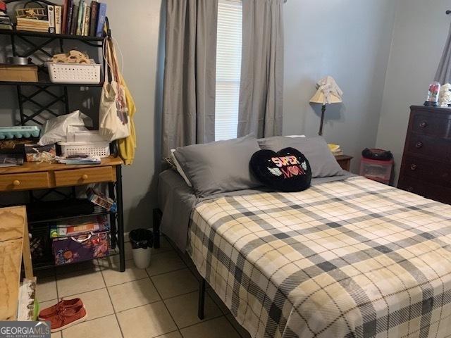 bedroom featuring tile patterned floors
