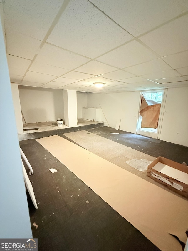 below grade area with a paneled ceiling