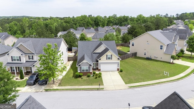 birds eye view of property with a residential view