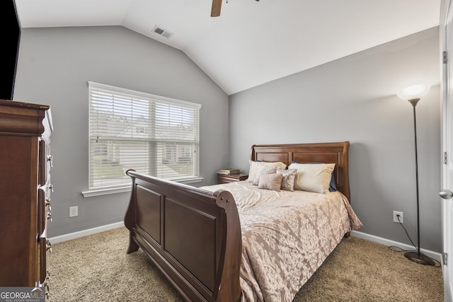bedroom with visible vents, a ceiling fan, baseboards, carpet flooring, and vaulted ceiling